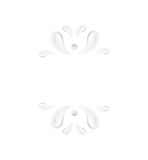 корова